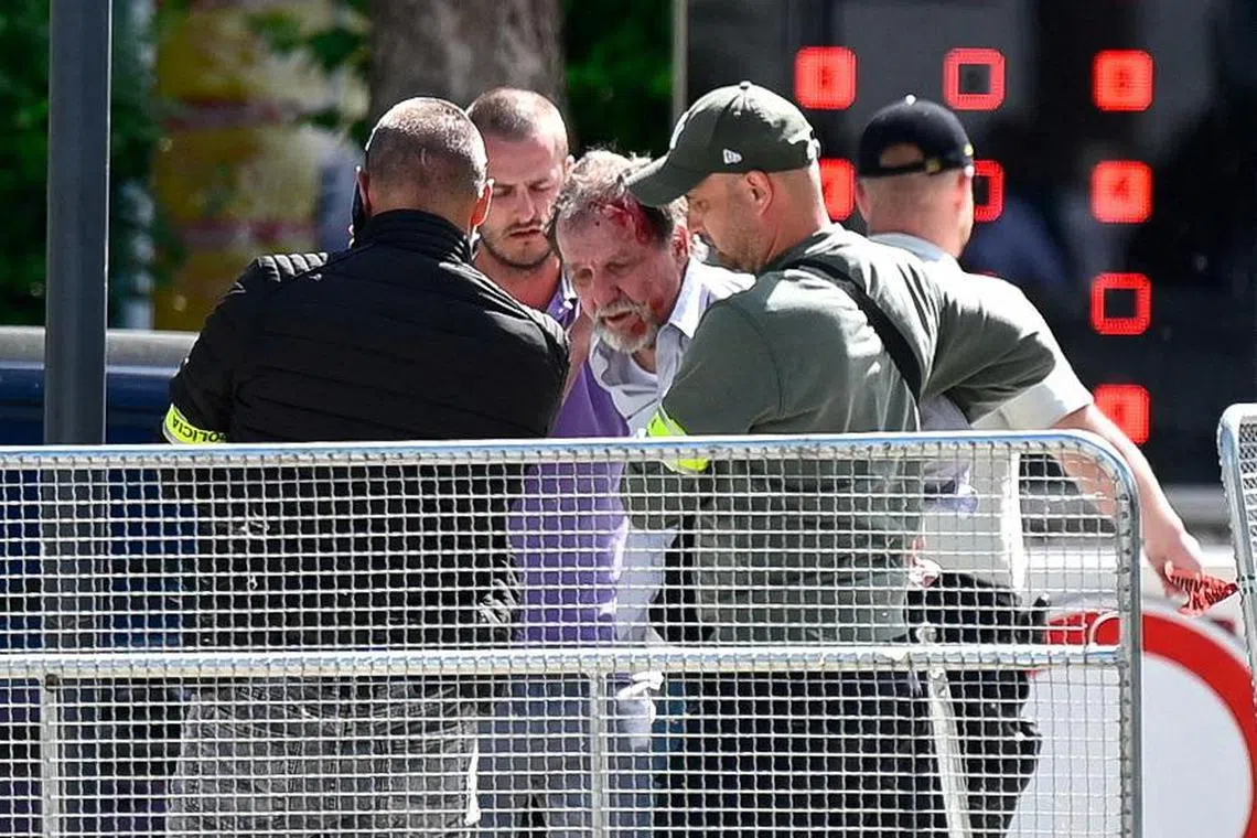 A person being detained after Slovak Prime Minister Robert Fico was shot five times in Handlova, Slovakia, on May 15.
