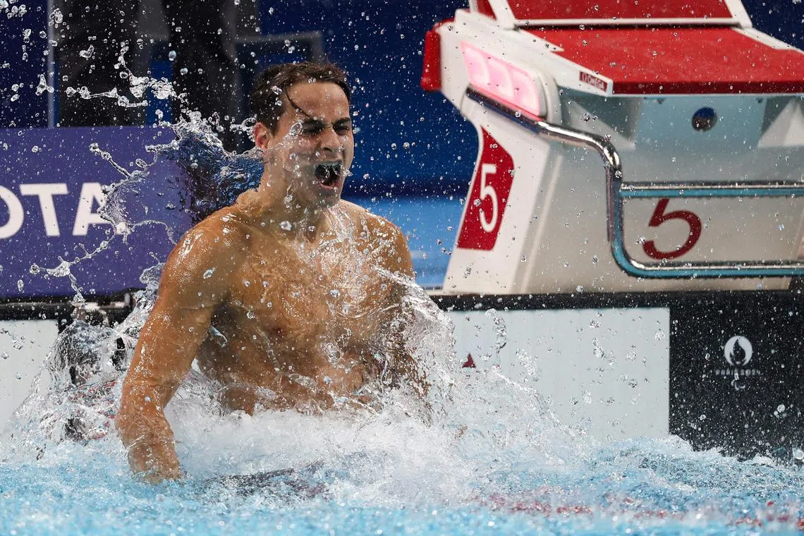 France's Ugo Didier celebrates after winning gold in the men's S9 400m freestyle swimming, at the Paralympics in Paris.