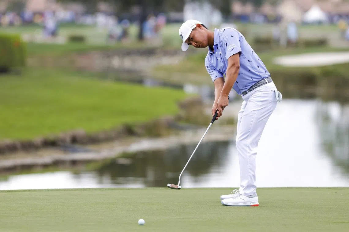 Justin Suh plays his shot on the 17th green during the second round of the Honda Classic.