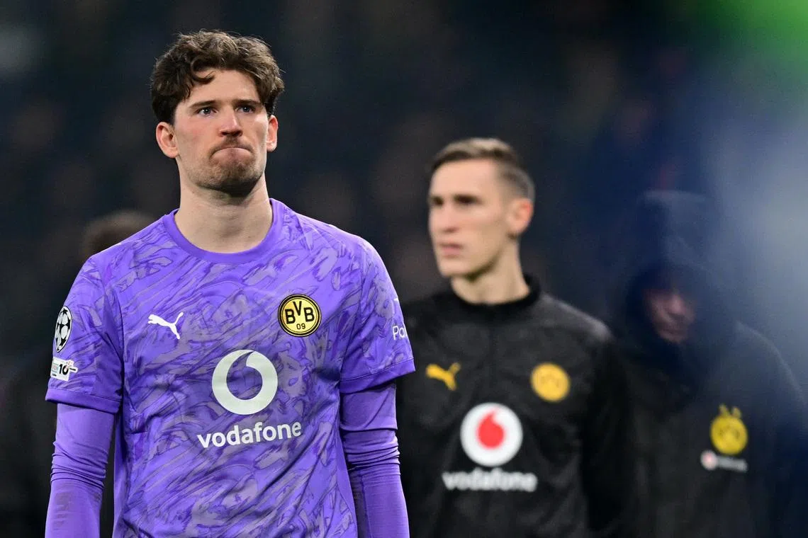Soccer Football - UEFA Champions League - Play Off - Second Leg - Atalanta v Borussia Dortmund - New Balance Arena, Bergamo, Italy - February 25, 2026 Borussia Dortmund's Gregor Kobel looks dejected after the match REUTERS/Daniele Mascolo