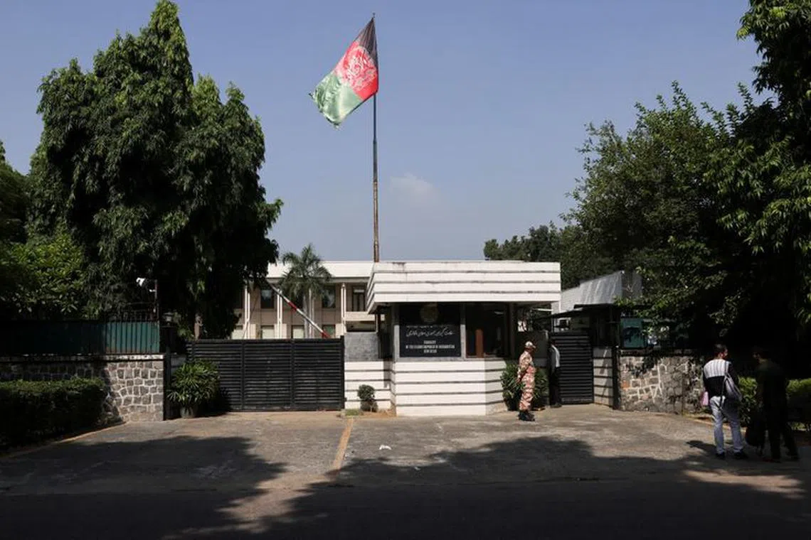 FILE PHOTO: People are seen outside the Afghanistan embassy in New Delhi, India, September 29, 2023. REUTERS/Anushree Fadnavis/File photo