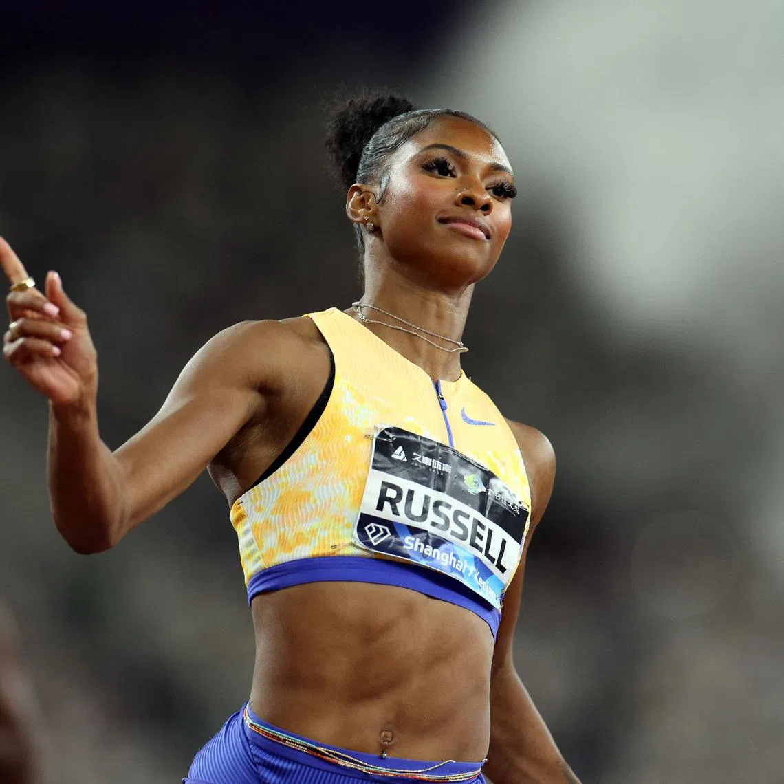 FILE PHOTO: Athletics - Diamond League - Shanghai/Keqiao - China Textile City Sports Center, Shaoxing, China - May 16, 2026 Masai Russell of the U.S. celebrates after winning the women's 100m hurdles as she breaks the meet record and becomes the new world leader REUTERS/Go Nakamura/File Photo