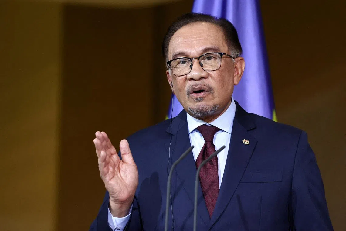 FILE PHOTO: Malaysia's Prime Minister Anwar Ibrahim holds a press conference with German Chancellor Olaf Scholz (not pictured) in Berlin, Germany, March 11, 2024. REUTERS/Liesa Johannssen/File Photo