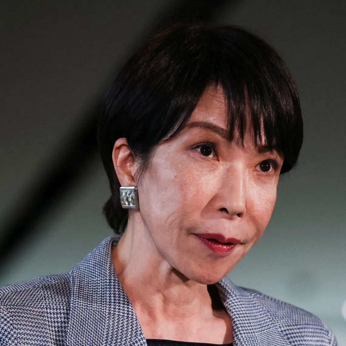 FILE PHOTO: Japan's Prime Minister Sanae Takaichi speaks to the media after a telephone call with U.S. President Donald Trump, at her official residence in Tokyo, Japan, November 25, 2025. REUTERS/Issei Kato/File Photo
