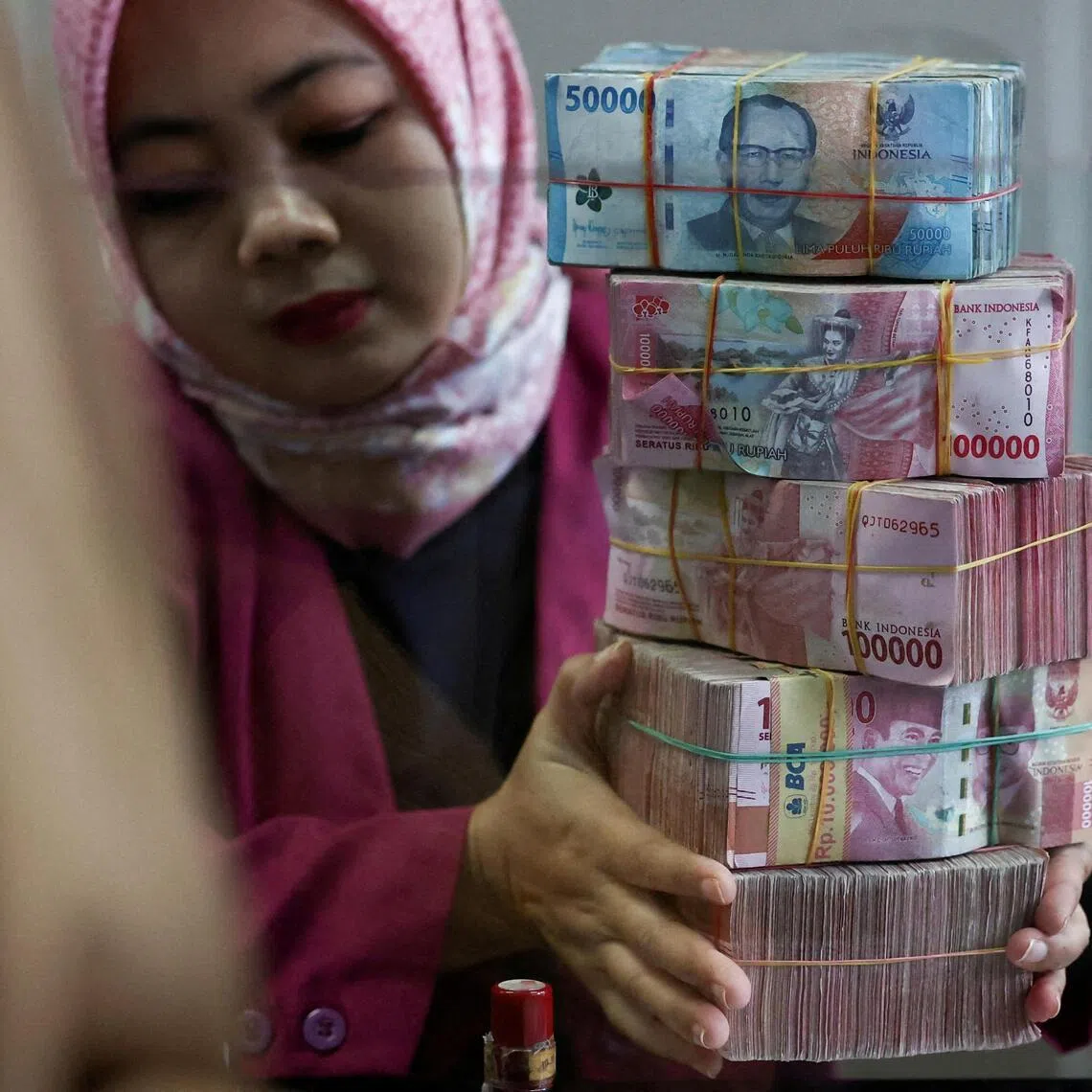 At the same time as the rupiah is falling, Jakarta is tightening rules on how export revenue is used.