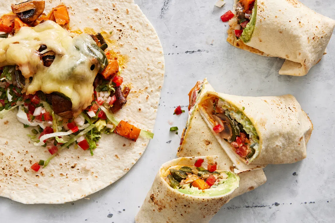 Roasted vegetable burritos are a great way to clear leftovers in the fridge.