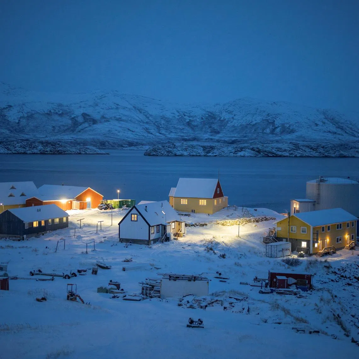 Lights illuminate the village of Kapisillit, Greenland, January 19, 2026. REUTERS/Marko Djurica