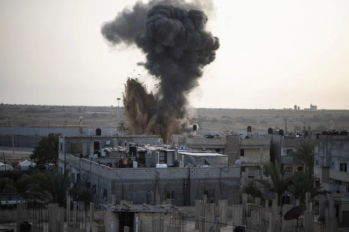 FILE PHOTO: Smoke rises following Israeli strikes, amid the ongoing conflict between Israel and the Palestinian Islamist group Hamas, in Rafah, in the southern Gaza Strip April 22, 2024. REUTERS/Mahdy Zourob/File Photo
