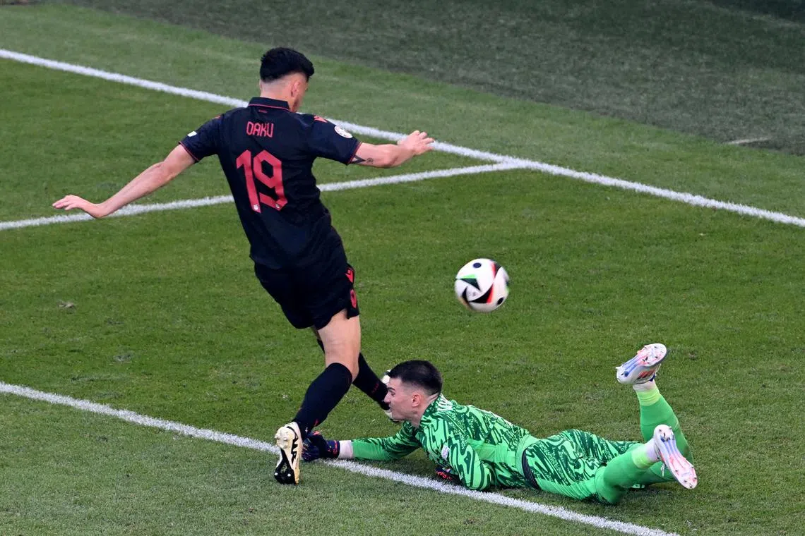 FILE PHOTO: Soccer Football - Euro 2024 - Group B - Croatia v Albania - Hamburg Volksparkstadion, Hamburg, Germany - June 19, 2024 Croatia's Dominik Livakovic in action with Albania's Mirlind Daku REUTERS/Carmen Jaspersen/File Photo