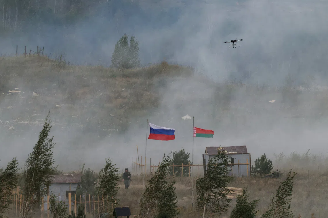 Russian and Belarusian flags fly at a training ground during the joint Russia-Belarus \"Zapad-2025\" military drills near Borisov, Belarus September 15, 2025. REUTERS/Ramil Sitdikov