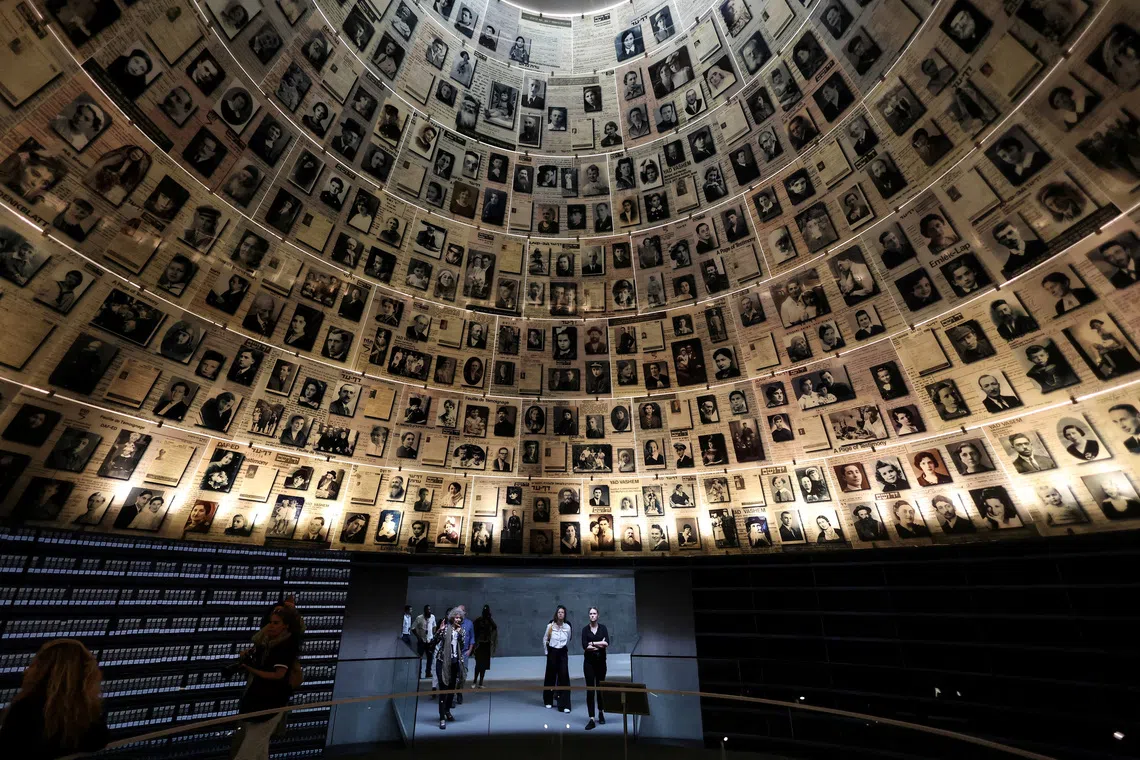 FILE PHOTO: Visitors tour an exhibition, ahead of Israel's national Holocaust memorial day at Yad Vashem, the World Holocaust Remembrance Center, in Jerusalem April 23, 2025. REUTERS/Ronen Zvulun/File Photo