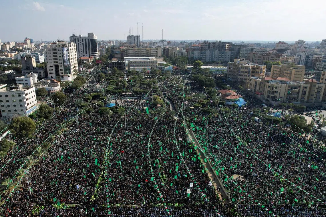 Palestinian Hamas supporters attend a rally marking the 35th anniversary of the movement founding, in Gaza City, Dec 14, 2022.