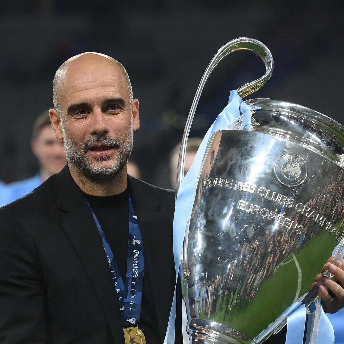 Manchester City manager Pep Guardiola with the Champions League trophy after winning the competition on June 10, 2023. 