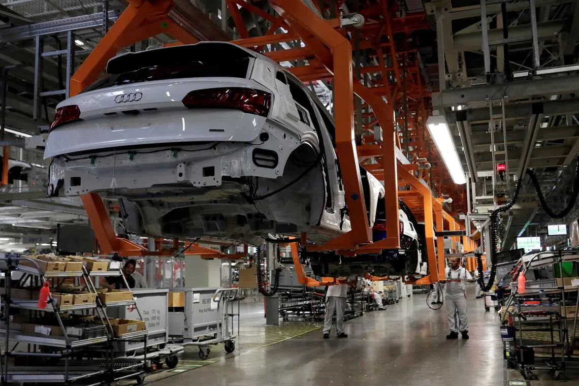 FILE PHOTO: Employees work at an Audi Q5 2.0 production line of the German car manufacturer's plant during a media tour in San Jose Chiapa, Mexico April 19, 2018. REUTERS/Henry Romero/File Photo
