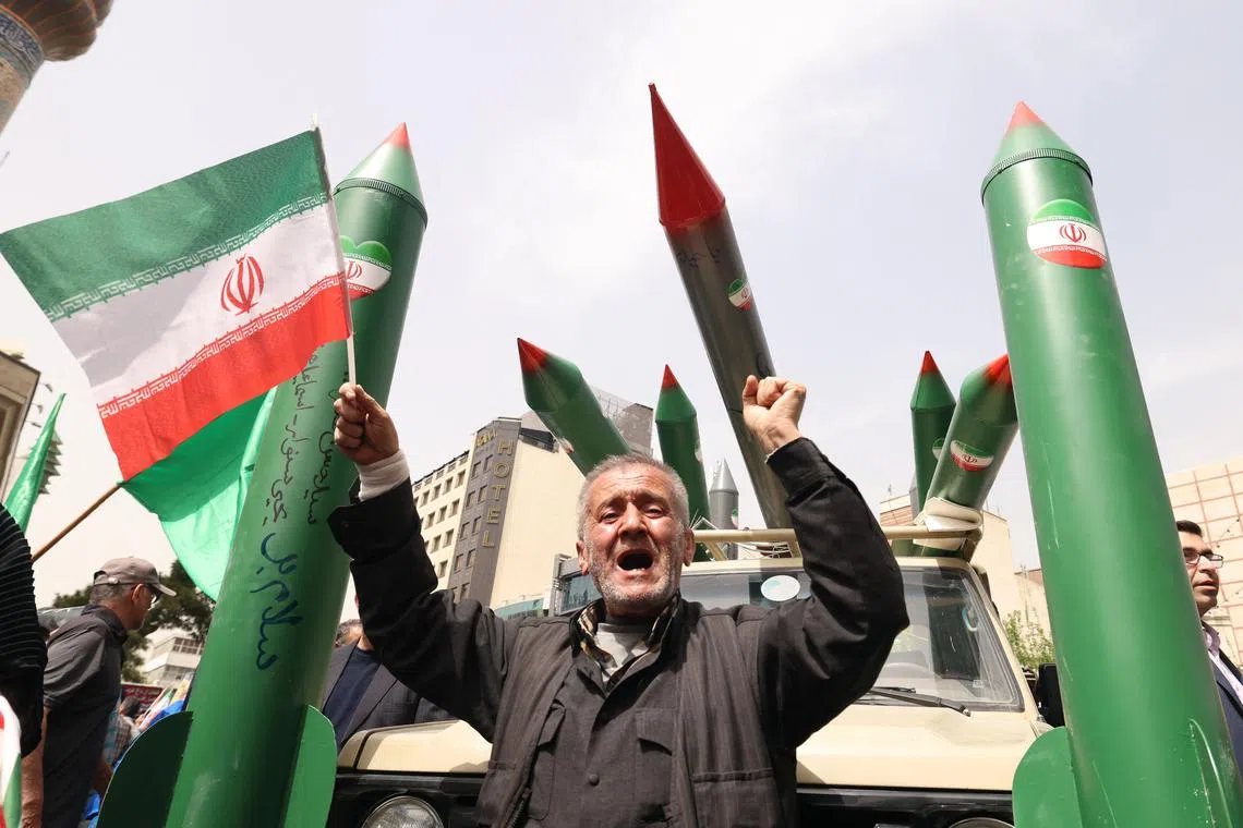 Iran is approaching weekend talks with the United States over its nuclear programme warily.