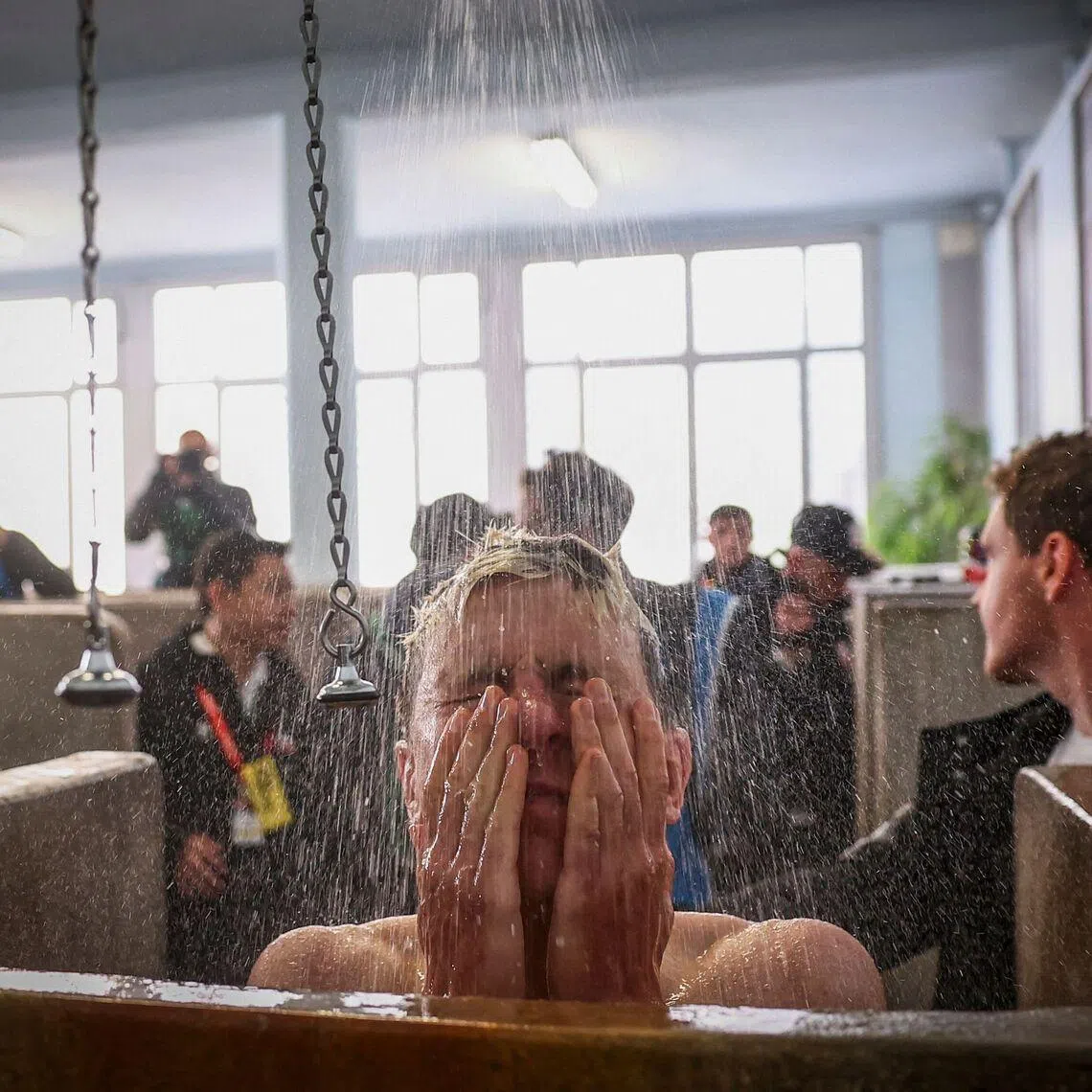 UAE Team Emirates XRG's Slovenian rider Tadej Pogacar taking a shower at the end of the 123rd edition of the Paris-Roubaix one-day classic cycling race, at the Vélodrome André-Pétrieux in Roubaix, northern France, on April 12, 2026. 