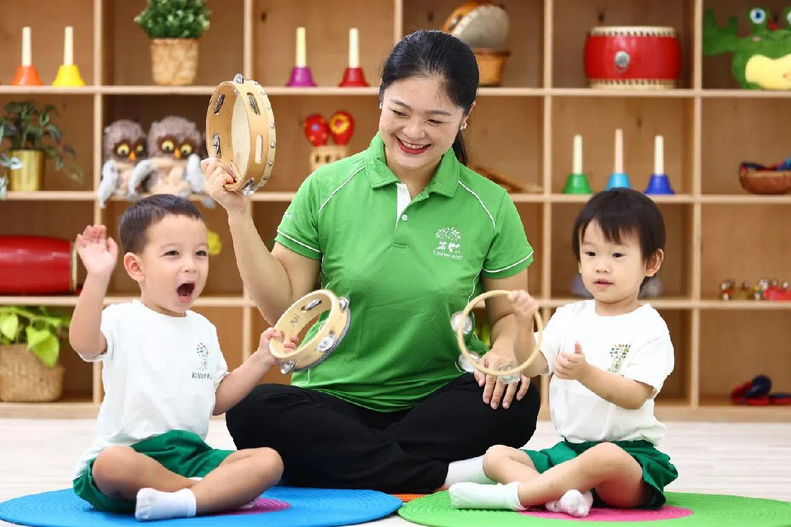 Kinderland students playing musical instruments 