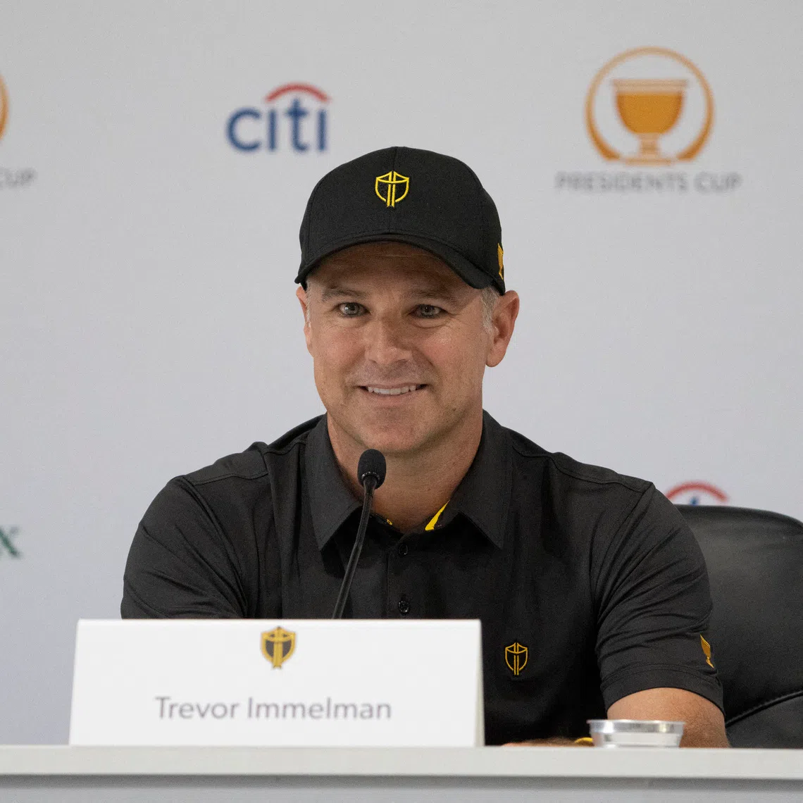 Sep 20, 2022; Charlotte, North Carolina, USA; International Team captain Trevor Immelman smiles while addressing the media in a press conference during a practice day for the Presidents Cup golf tournament at Quail Hollow Club. Mandatory Credit: Kyle Terada-USA TODAY Sports