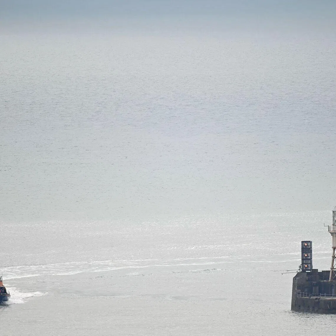 Migrants picked up at sea, while attempting to cross the English Channel from France, at the Port of Dover in England on April 1. Such crossings are sometimes part of trips arranged by smugglers.