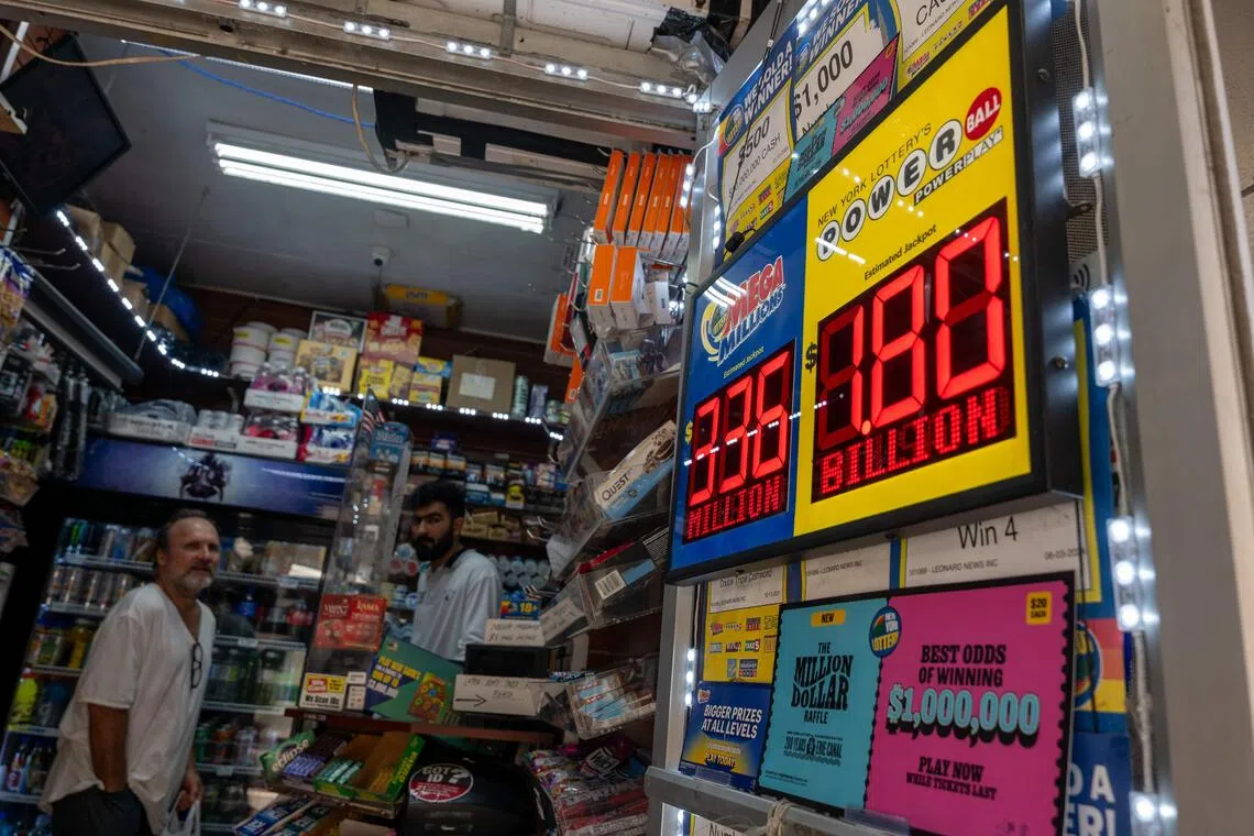 NEW YORK CITY - SEPTEMBER 05: A newsstand in Manhattan advertises the latest Powerball Jackpot, now reaching $1.8 billion, on September 05, 2025, in New York City. Saturday night's drawing will follow no winners from Wednesday's $1.4 billion grand prize, Powerball said.   Spencer Platt/Getty Images/AFP (Photo by SPENCER PLATT / GETTY IMAGES NORTH AMERICA / Getty Images via AFP)
