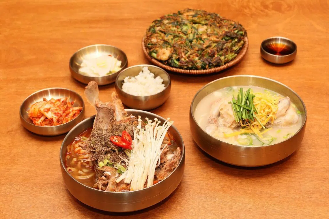 From top, clockwise, Morning Glory Shrimp Pancake, Half Chicken Noodles and Pork Bone Spicy Noodles at Seoul Noodle Shop at VivoCity.