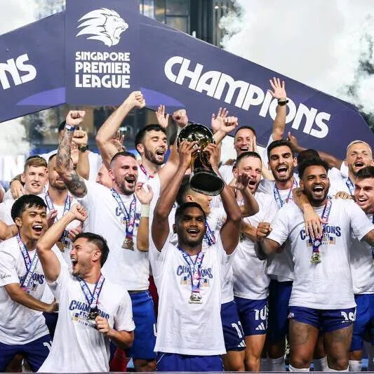 Lion City Sailors captain Hariss Harun lifting the Singapore Premier League title alongside his teammates at Our Tampines Hub on May 17, 2026. 