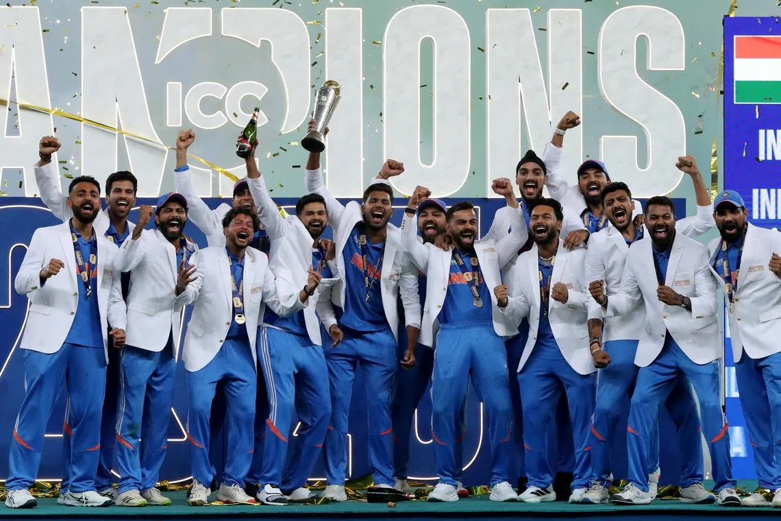 Cricket - ICC Men's Champions Trophy - Final - India v New Zealand - Dubai International Stadium, Dubai, United Arab Emirates - March 9, 2025 General view as India players celebrate with the trophy on the podium after winning the ICC Men's Champions Trophy REUTERS/Satish Kumar