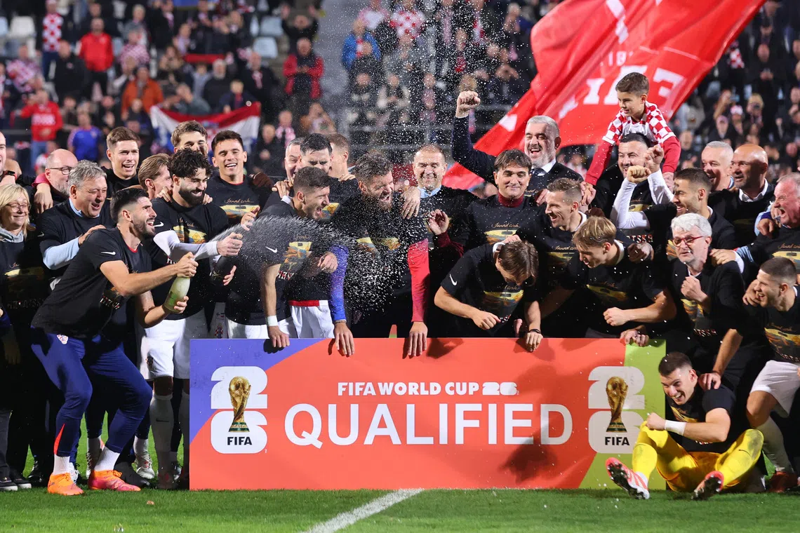 Soccer Football - World Cup - UEFA Qualifiers - Group L - Croatia v Faroe Islands - Stadion HNK Rijeka, Rijeka, Croatia - November 14, 2025 Croatia playeres celebrate after qualifying for the World Cup finals REUTERS/Antonio Bronic