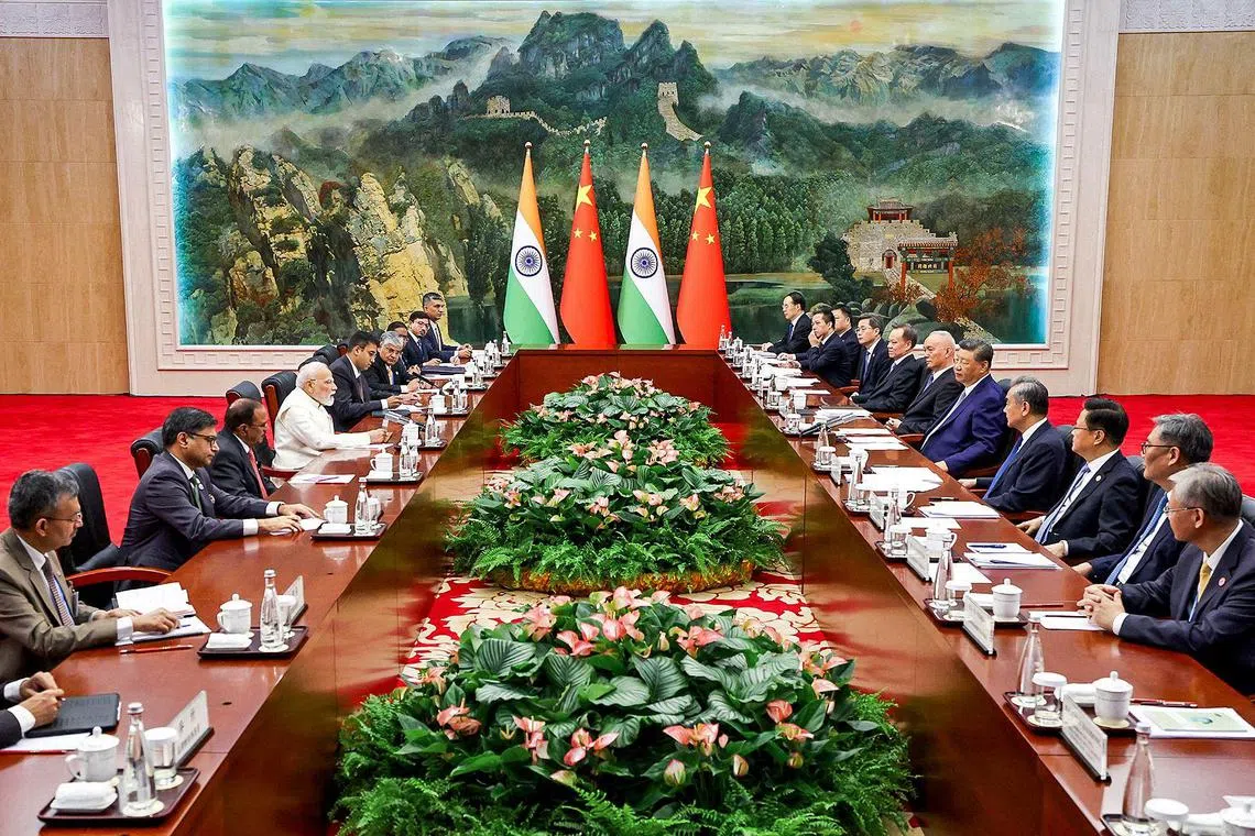 Indian PM Narendra Modi (fourth from left) and Chinese President Xi Jinping (fifth from right) with their respective delegations on the sidelines of the Shanghai Cooperation Organisation summit in Tianjin, on Aug 31.