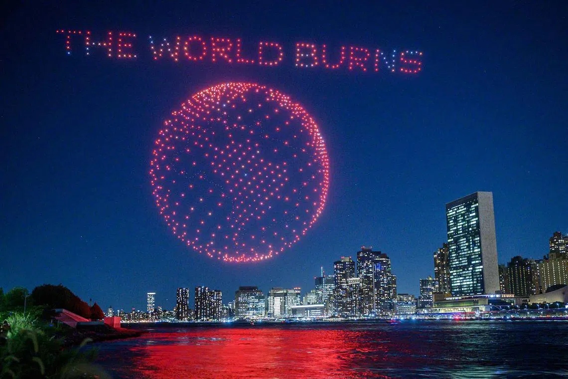 Drones fly to create a light display against the city skyline in New York City on Sept 15 as part of a campaign to raise awareness about the Amazon rainforest and the global climate crisis ahead of the 78th United Nations General Assembly and Climate Ambition Summit