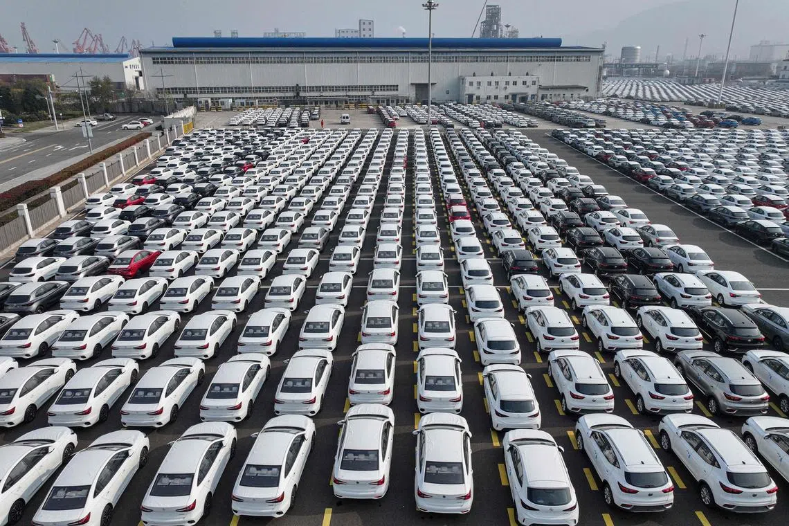 Cars for export parked at a port in Lianyungang, in eastern China's Jiangsu province on Dec 5, 2024.