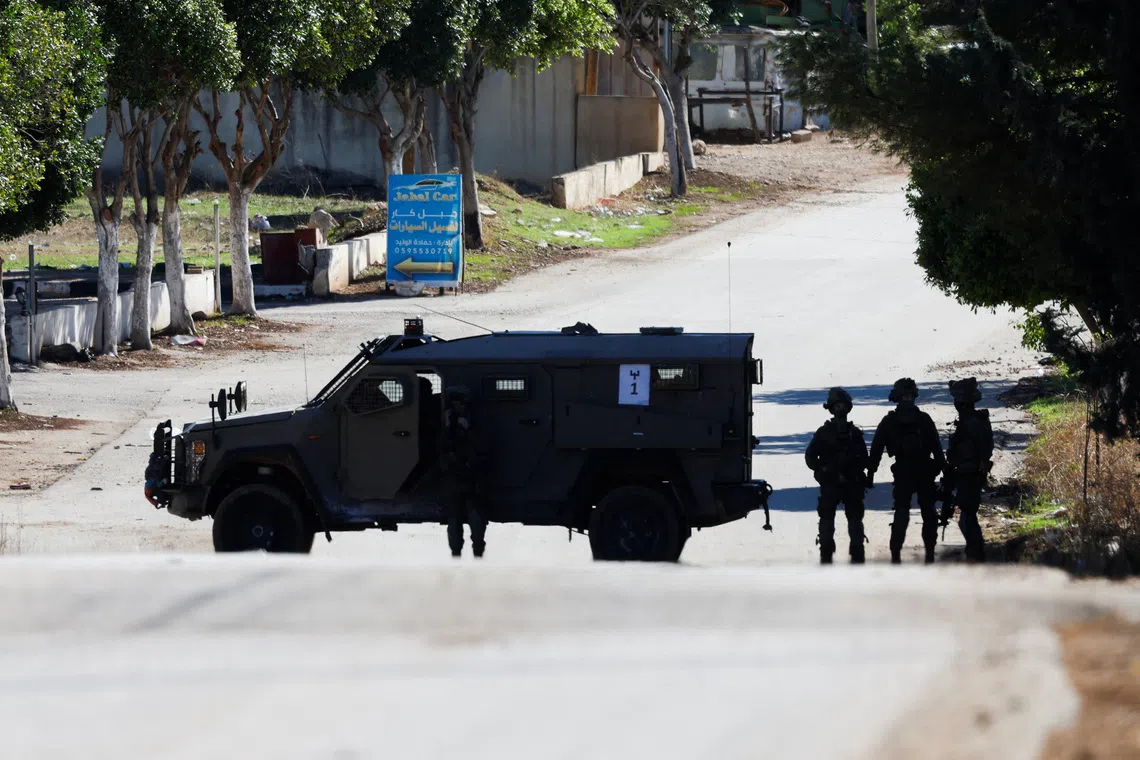 A military vehicle operates during an Israeli raid in Tammun near Tubas in the Israeli-occupied West Bank, November 26, 2025. REUTERS/Mohamad Torokman