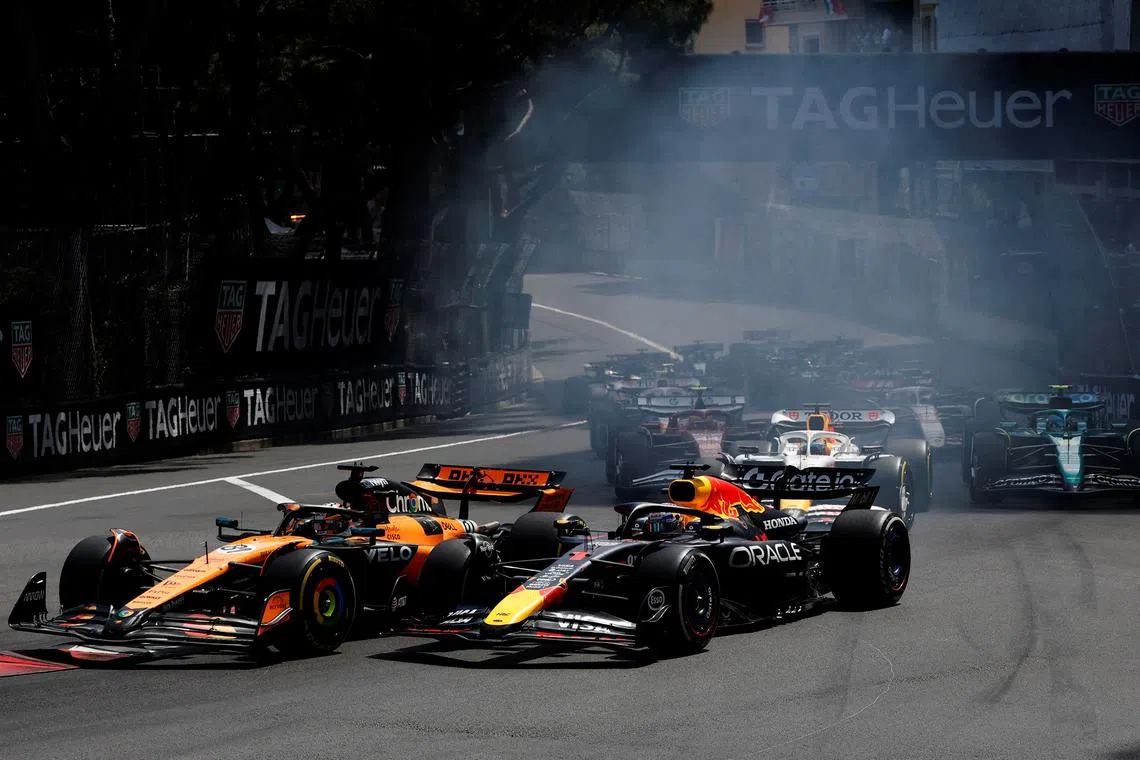 FILE PHOTO: Formula One F1 - Monaco Grand Prix - Circuit de Monaco, Monaco - May 25, 2025 McLaren's Oscar Piastri and Red Bull's Max Verstappen in action REUTERS/Stephanie Lecocq/File Photo