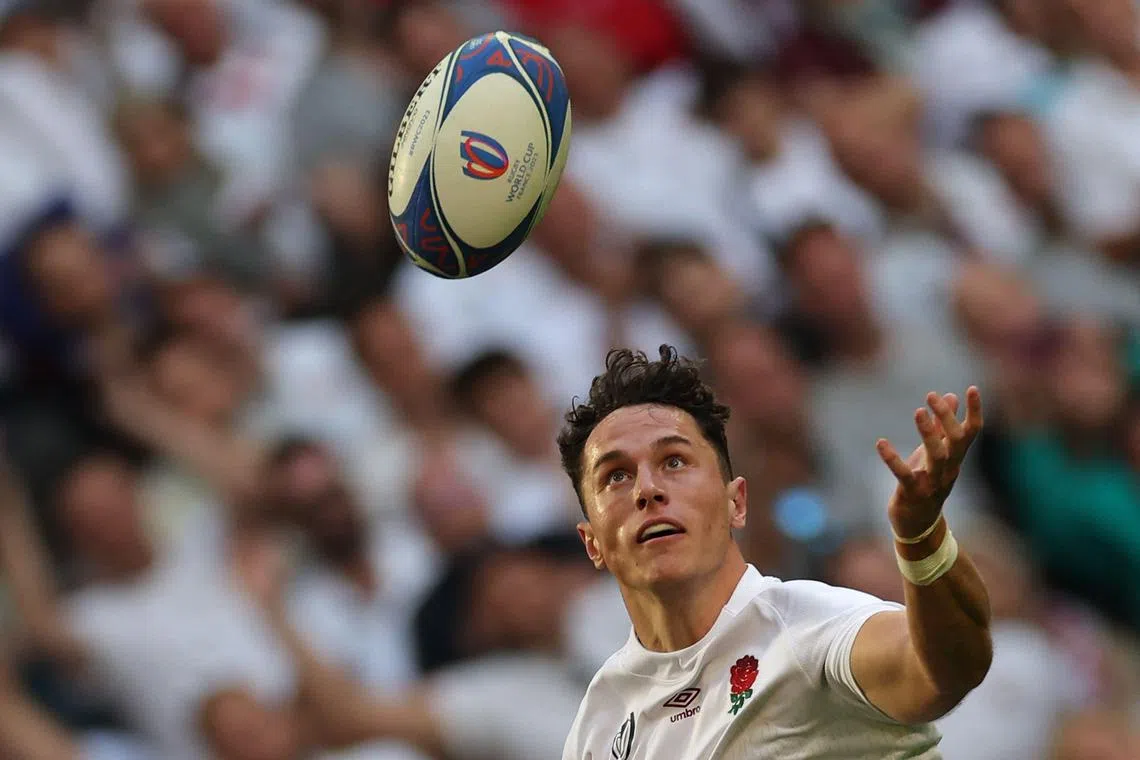 England winger Henry Arundell juggles the ball on his way to scoring a try against Chile.
