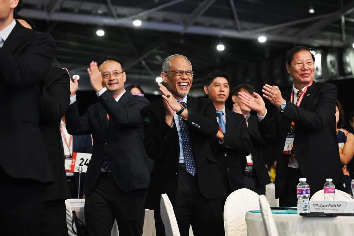 Second Minister for Health Mr Masagos Zulkifli participates in the mass exercise with (extreme right) Professor Phillip Choo, Group CEO of National Healthcare Group, at the 21st Singapore Health & Biomedical Congress (SHBC) 2023 on October 12. 

ST Photo: Azmi Athni
