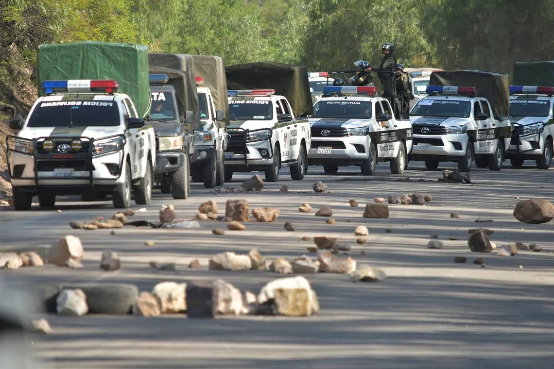 Police vehicles line up while attempting to dismantle a blockade set by supporters of Bolivia's former President Evo Morales in protest of the government of President Luis Arce, in Parotani, Bolivia October 25, 2024. REUTERS/Patricia Pinto/File Photo