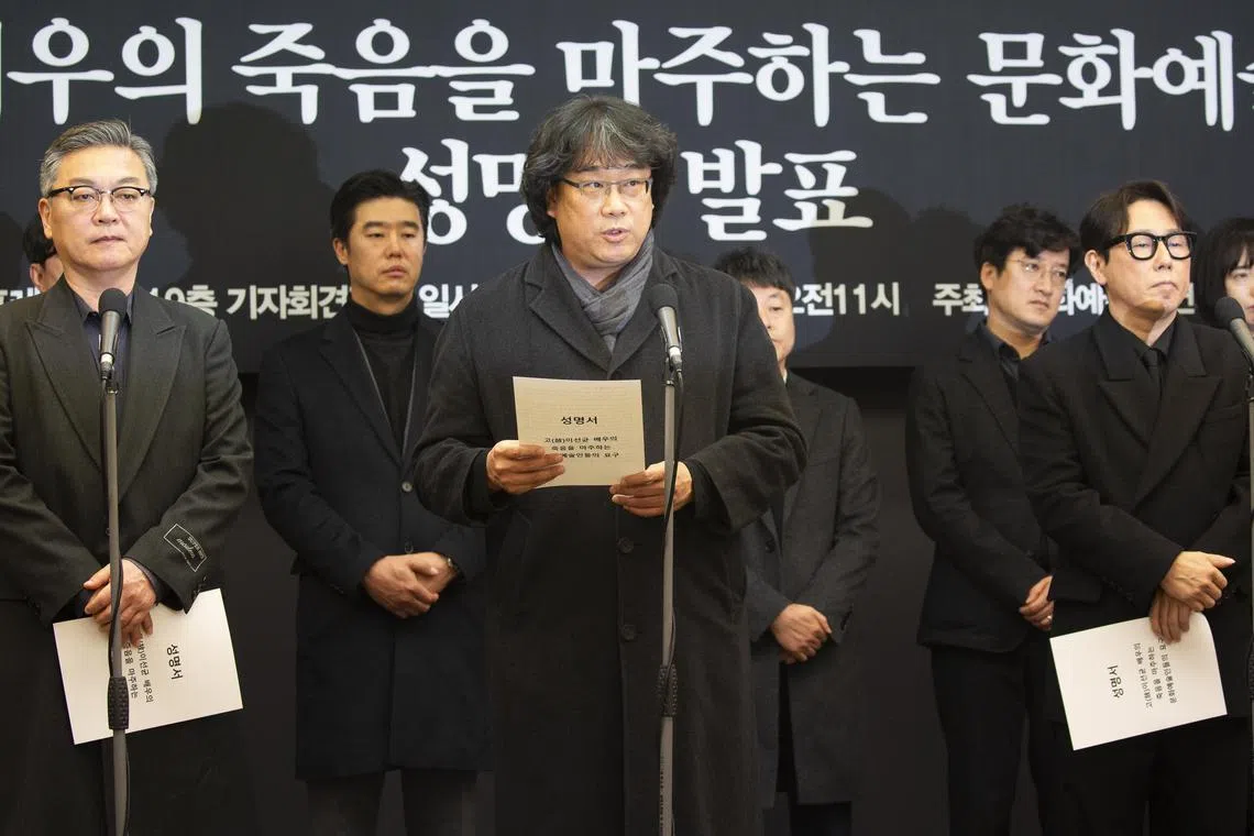 South Korean director Bong Joon-ho (centre) speaks with members of Cultural and Art Organisation during a press conference demanding an investigation into the case for the death of the late actor Lee Sun-kyun.