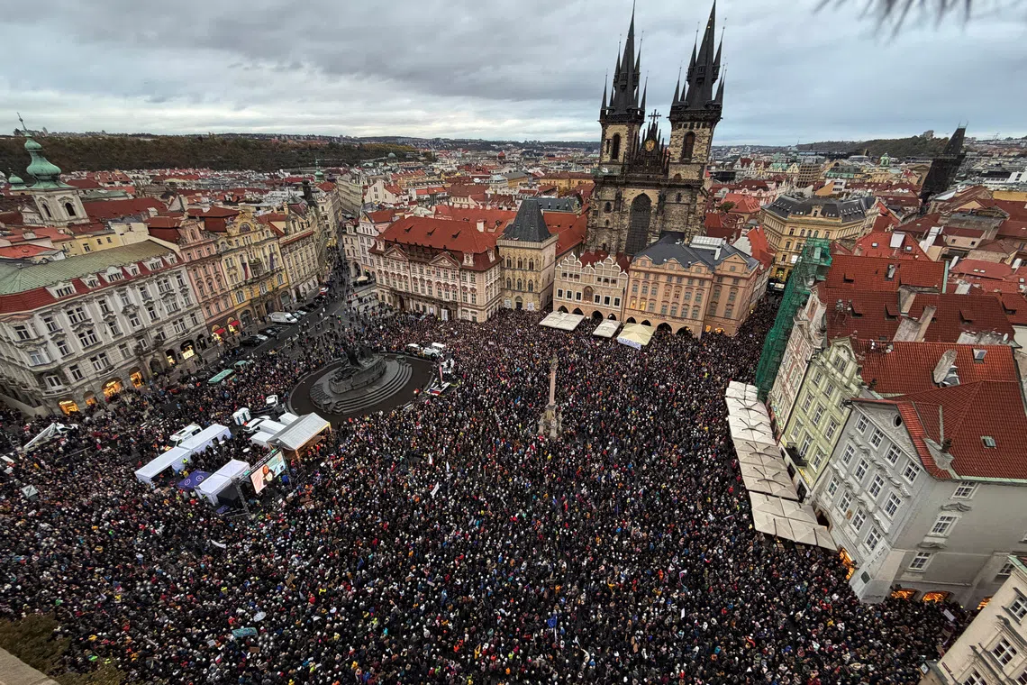 People attend a protest rally in support of public media at the Old Town Square in Prague, Czech Republic, on Oct 25.