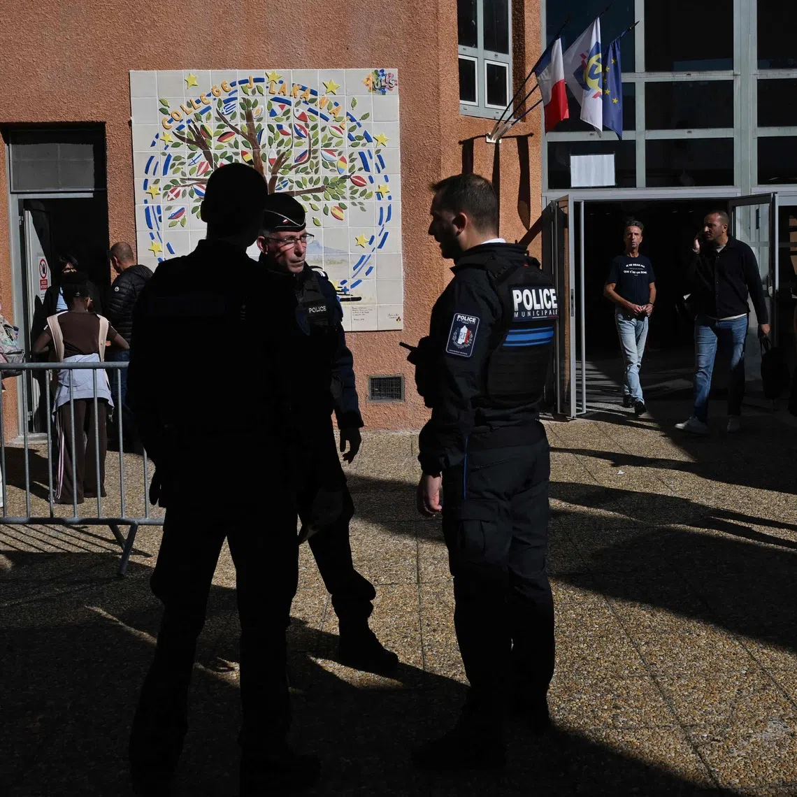 Policemen at Joseph Lakanal college in Aubagne, southern France, after a shooting incident on Oct 12.