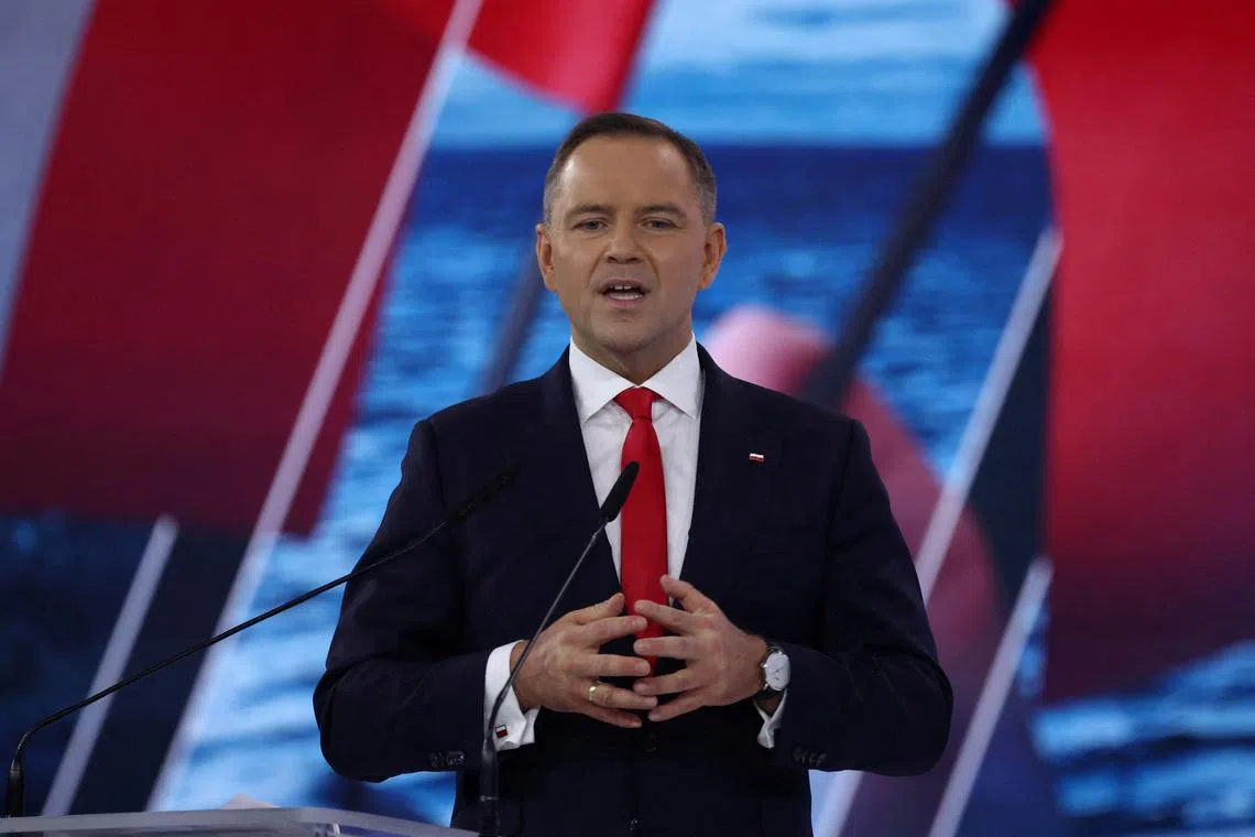FILE PHOTO: Karol Nawrocki, a candidate for Polish presidential election in 2025 supported by Poland's main opposition party Law and Justice (PiS), speaks during an election convention in Szeligi, Poland, March 2, 2025. REUTERS/Kacper Pempel/File Photo