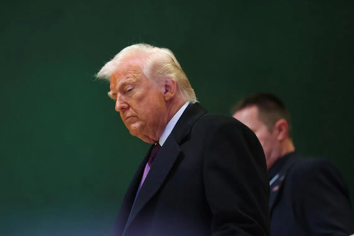 U.S. President Donald Trump walks during the 56th annual World Economic Forum (WEF) meeting in Davos, Switzerland, January 22, 2026. REUTERS/Denis Balibouse