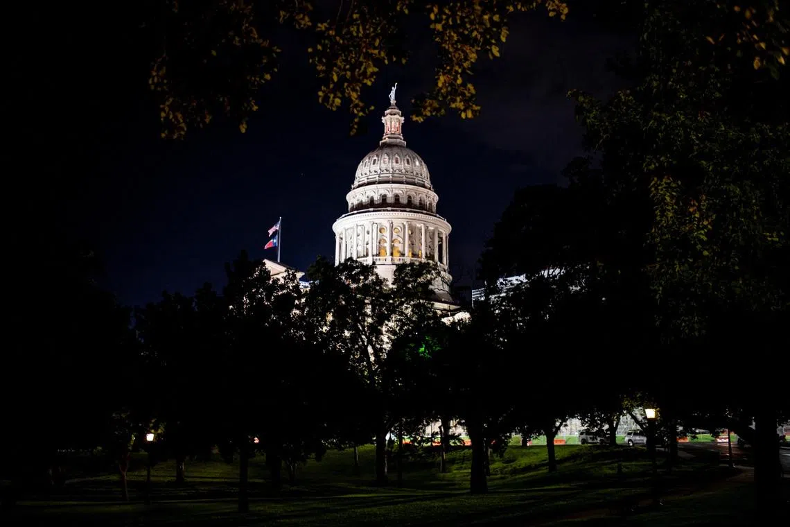 The Texas Capitol is lit during a session in the State Senate, as Republicans attempt to pass an HB 4, a bill that would redraw the state's 38 Congressional Districts, in Austin, Texas, U.S. August 22, 2025. REUTERS/Sergio Flores