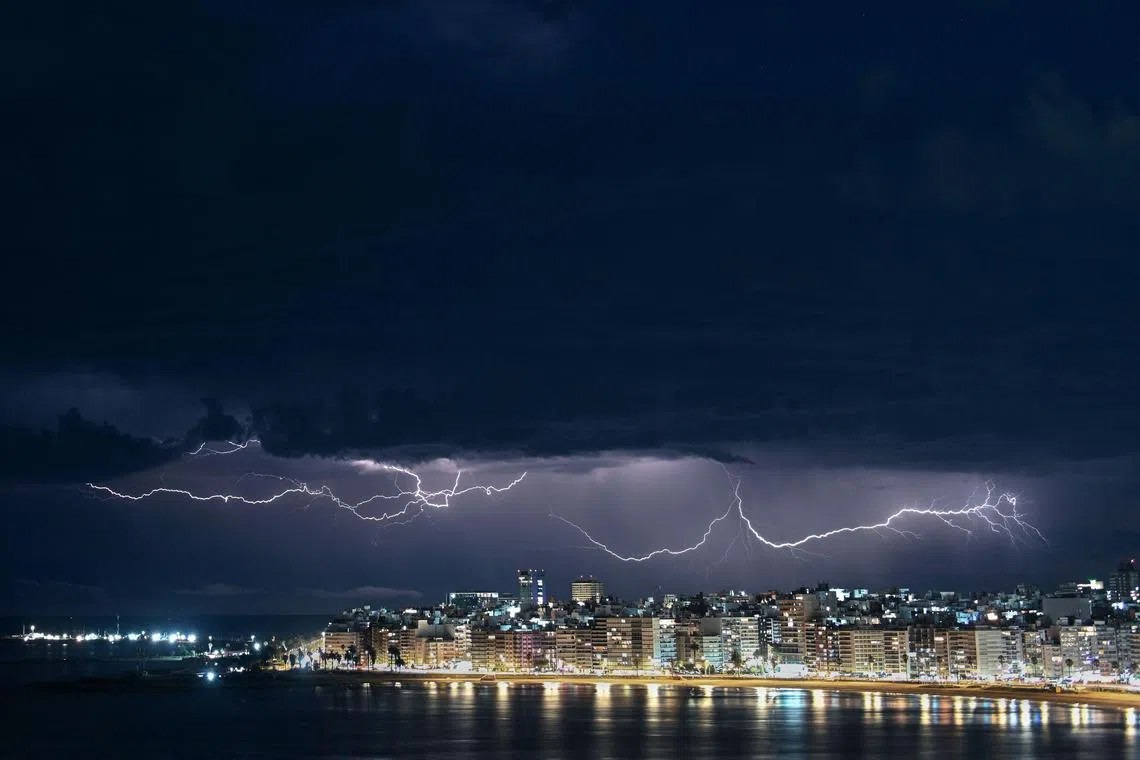 Lightning is seen during a thunderstorm over Montevideo, Uruguay on Jan 1, 2025.
