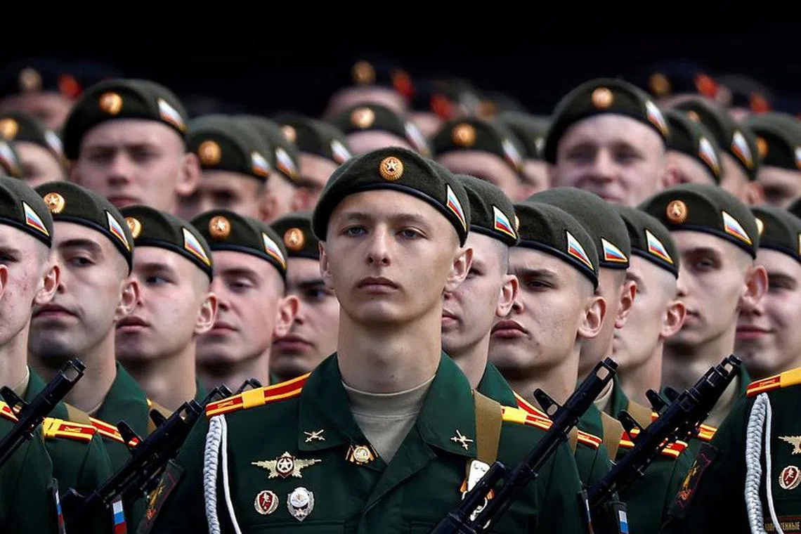 FILE PHOTO: Russian servicemen line up during a rehearsal for the Victory Day parade, which marks the anniversary of the victory over Nazi Germany in World War Two, in Red Square in central Moscow, Russia May 7, 2021. REUTERS/Maxim Shemetov/File Photo