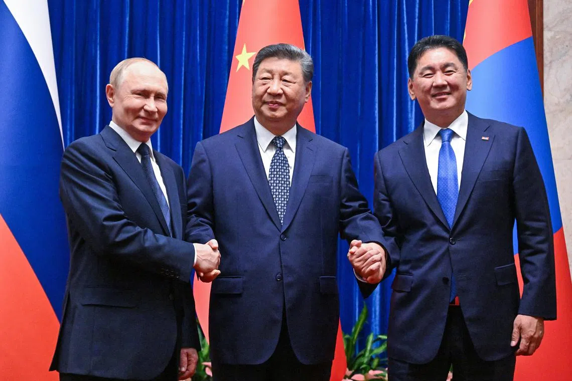 FILE PHOTO: Russian President Vladimir Putin, Chinese President Xi Jinping and Mongolian President Ukhnaagiin Khurelsukh pose for a picture before a meeting in Beijing, China September 2, 2025. Sputnik/Sergey Bobylev/Pool via REUTERS/File Photo