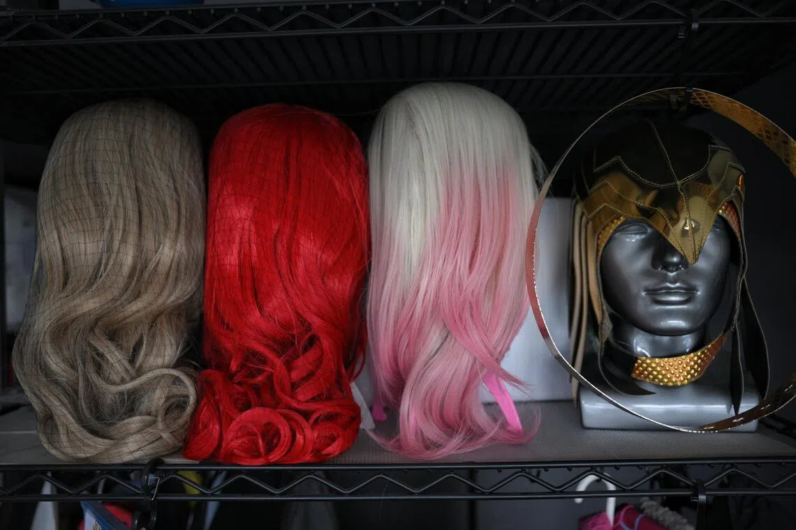 Wigs and costumes belonging to Susie Low, which she displays at home.