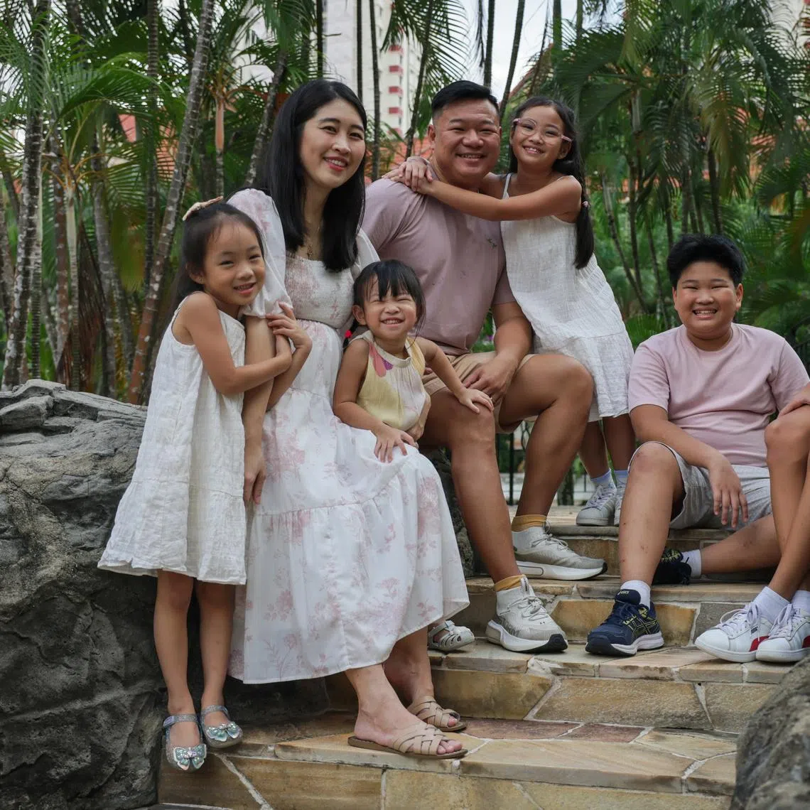 Teacher Clement Chua and freelance writer Kelly Ang, who is expecting their sixth child, with their children.