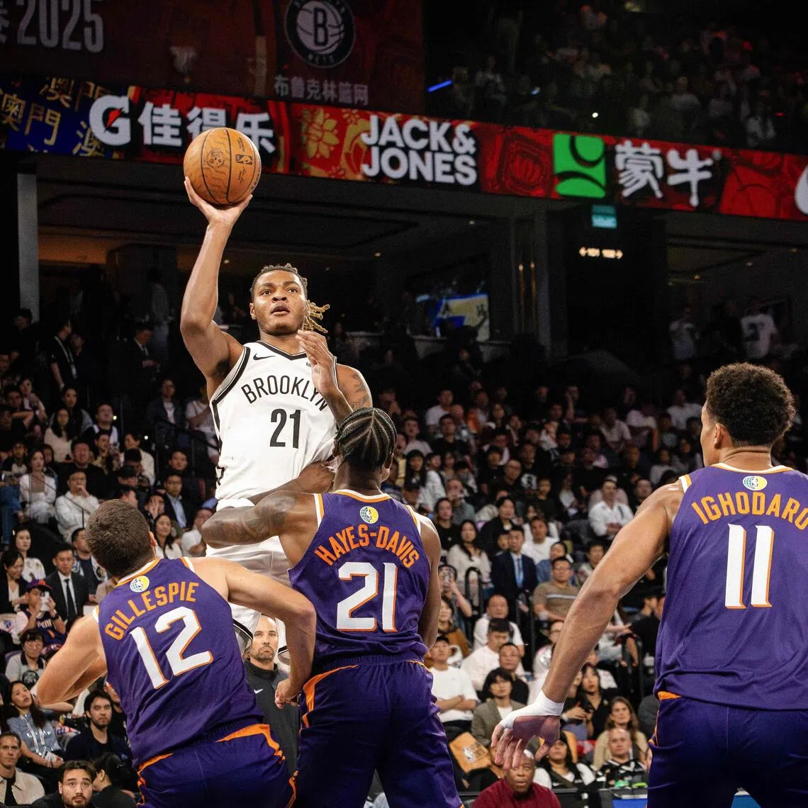 The Brooklyn Nets' Noah Clowney shoots to the basket during the NBA pre-season game against the Phoenix Suns, at the Venetian Arena in Macau.