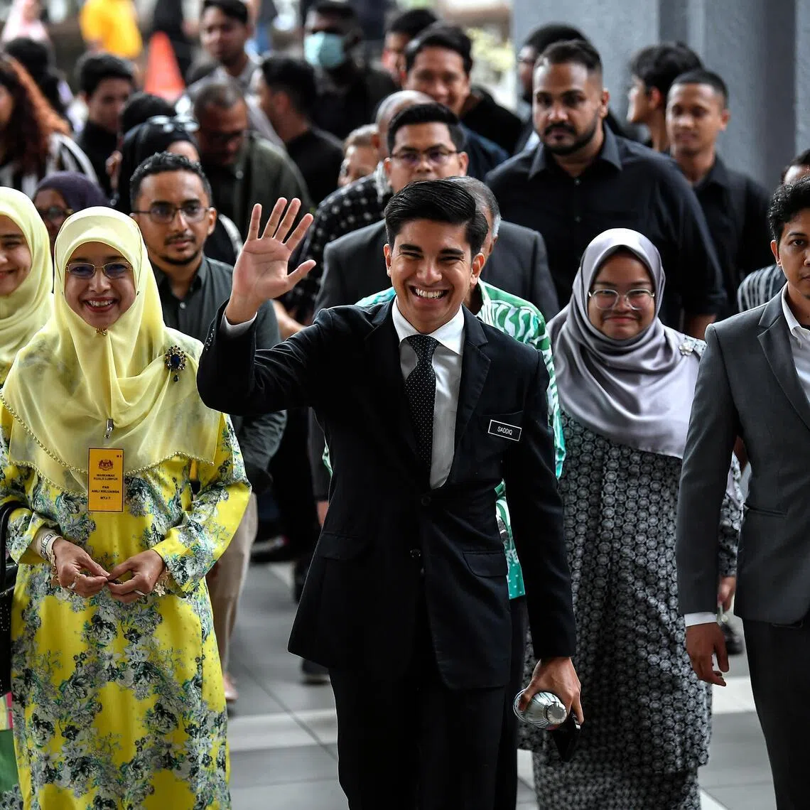 Former minister Syed Saddiq Syed Abdul Rahman (centre) pledged to serve his constituents and remain an active member of MUDA party until Parliament dissolves.