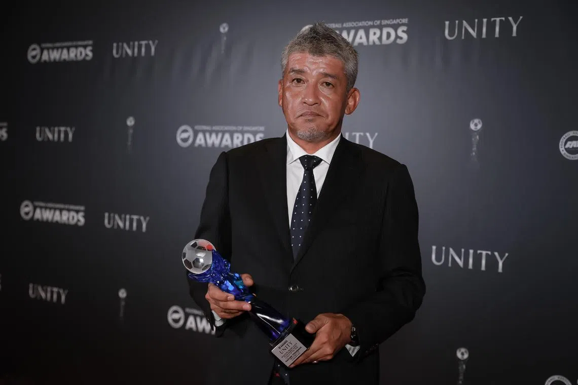 Kazuaki Yoshinaga with his Singapore Premier League coach of the year trophy at the Football Association of Singapore Awards Night held at Orchard Hotel, Nov 23, 2023.